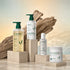 Kadūra Balance & Repair Set for oily scalp and dry ends on a warm stone display with driftwood