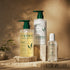 Kadūra CurlDefine Trio for curly hair with shampoo, conditioner and botanical hair perfume oil on stone pedestals