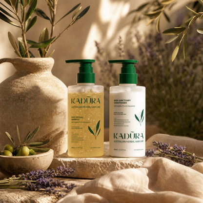 Kadūra SilkFlow shampoo and conditioner duo in a sunlit botanical setting