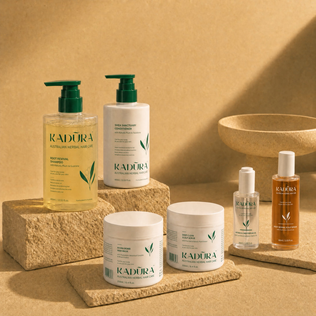 Kadūra Timeless Complete Scalp &amp; Hair Care Set in a warm botanical display